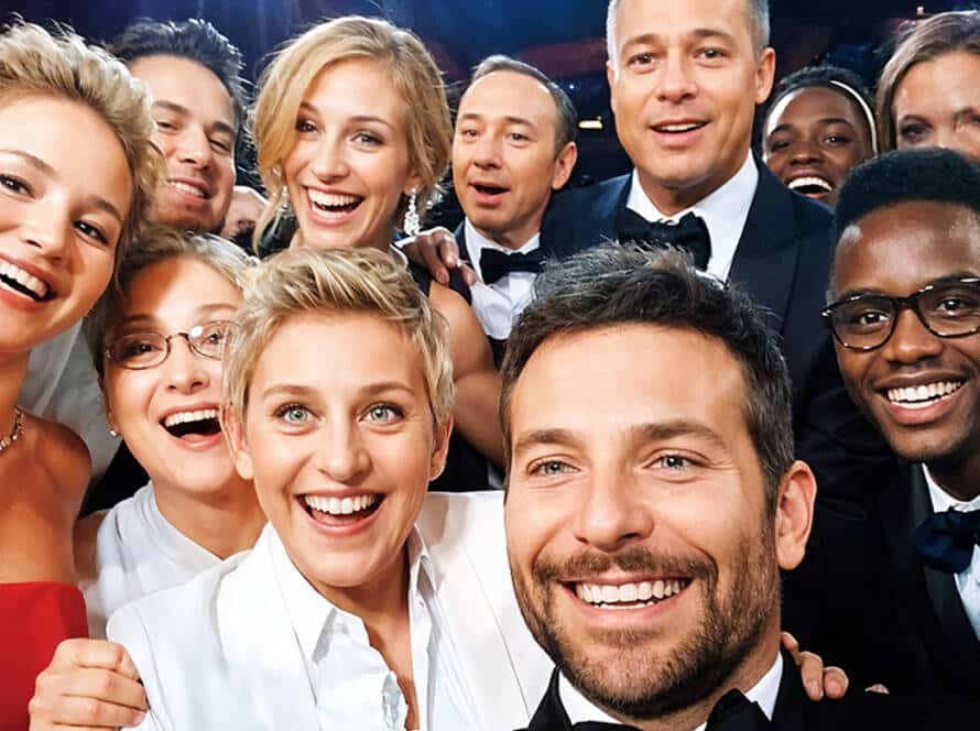 Celebrities flashing perfect white smiles on the red carpet, showcasing their dental veneers.